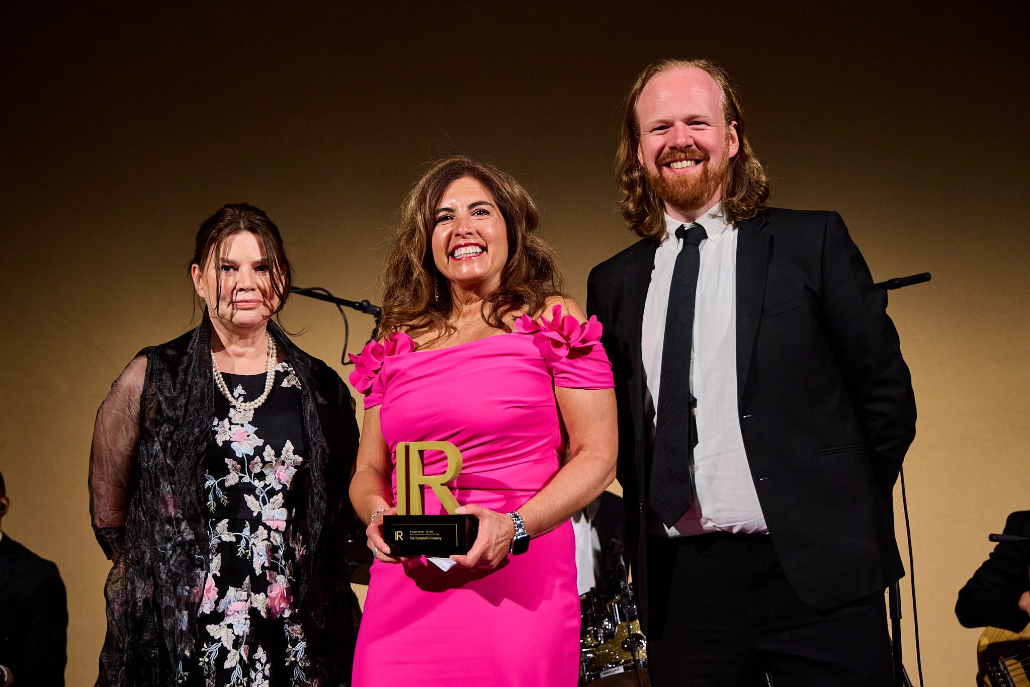 Rebecca Gardy of Campbell's picks up her trophy at IR Impact Awards - us 2025