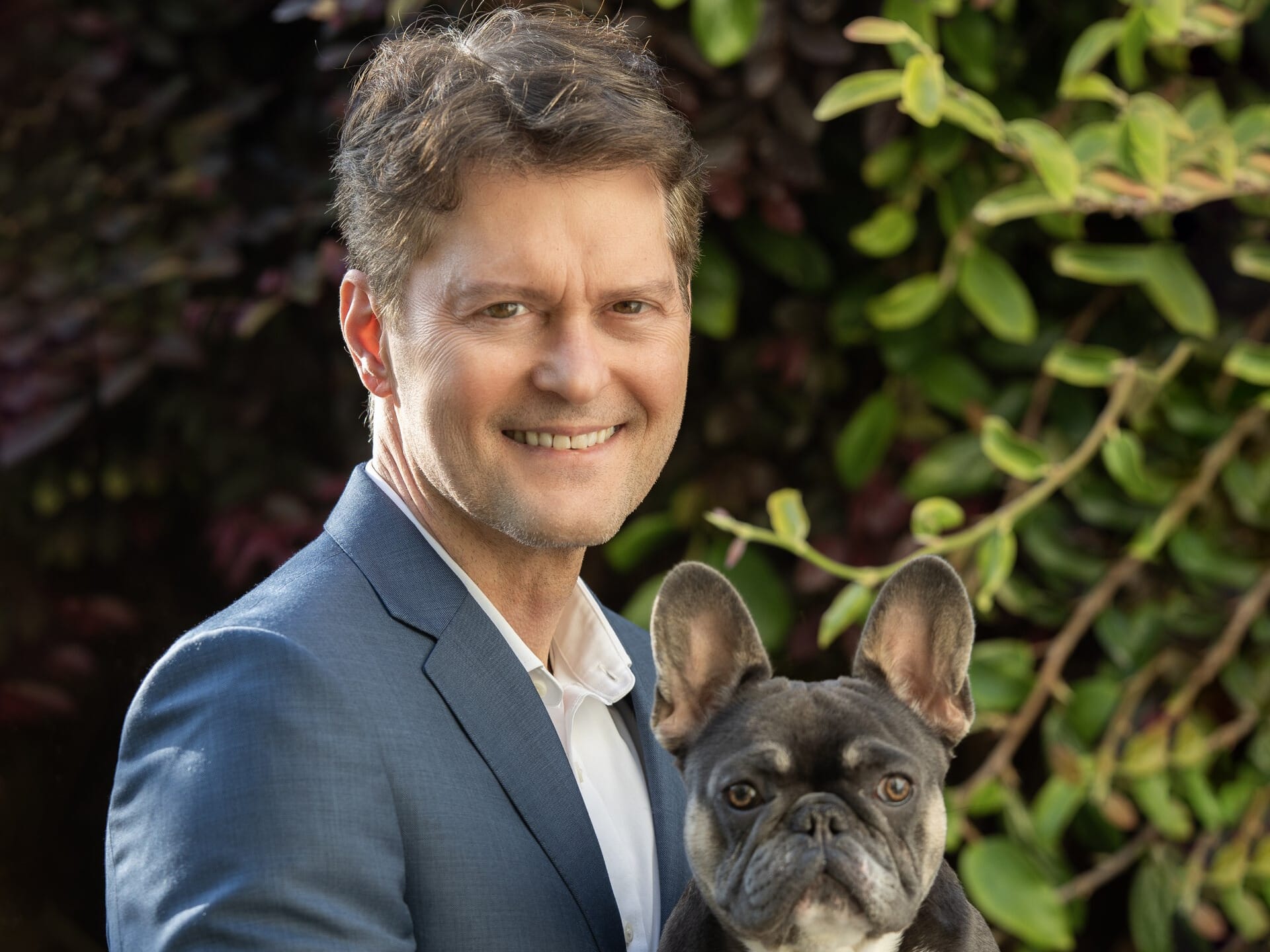 Central Garden & Pet CFO Brad Smith in his executive photo, with French bulldog Louis